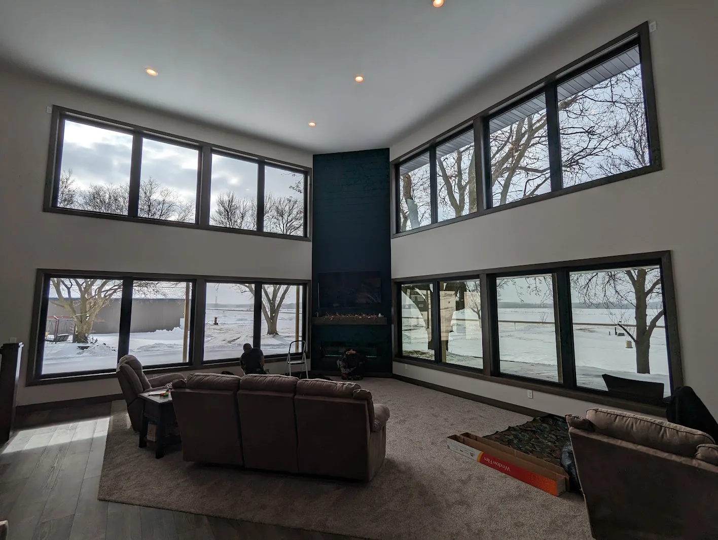 Living room with tall clerestory windows treated with dual-reflective window film
