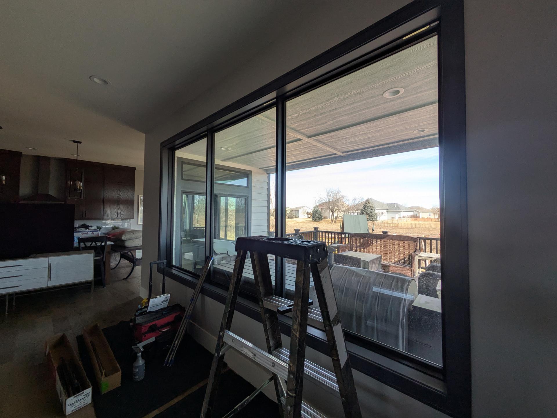 Living room windows during a solar window film install in Dakota Dunes