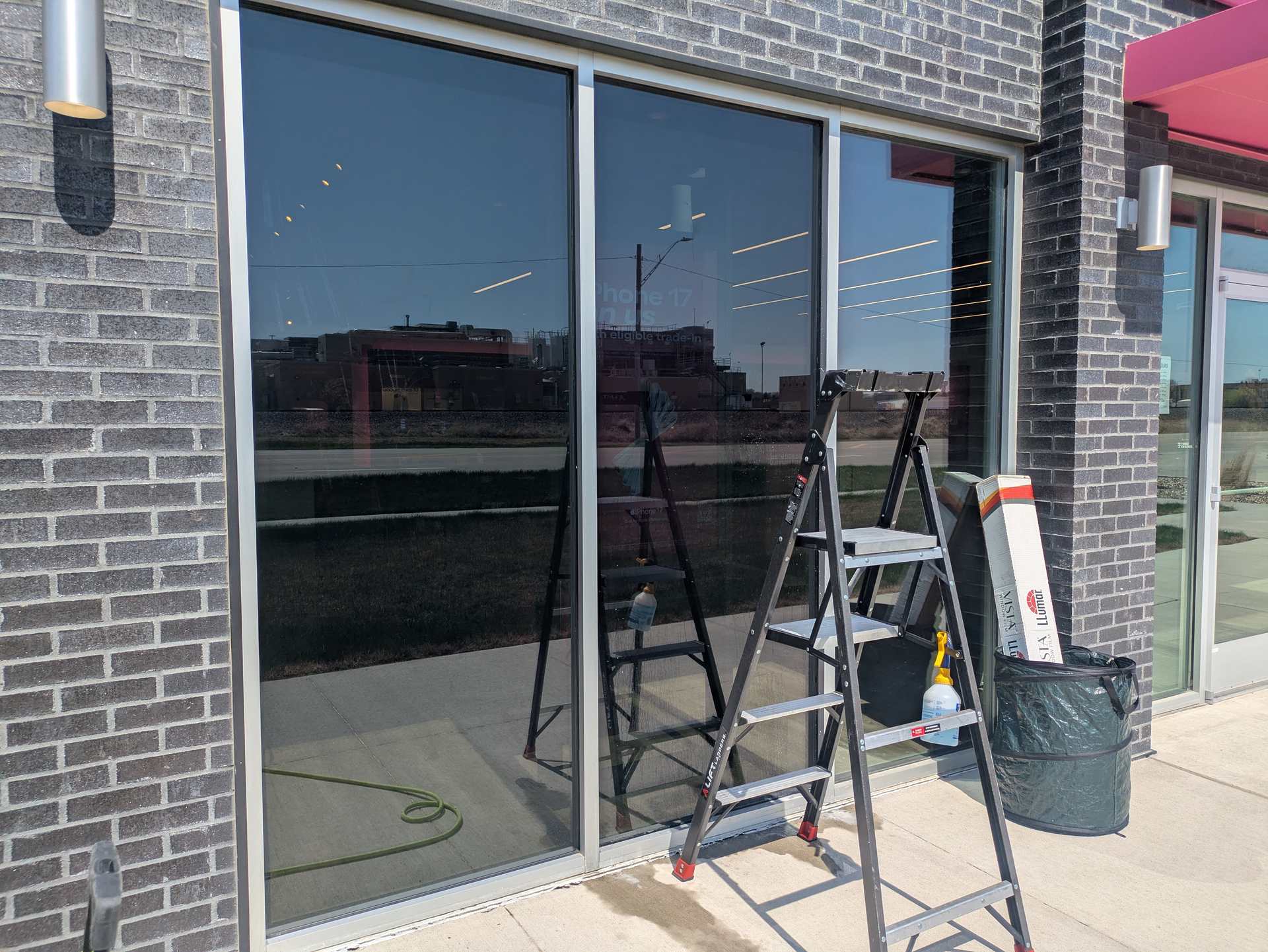 Storefront glass during a window film install in Le Mars, Iowa